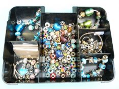 A collection of silver Pandora style beads