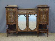 A 19thC rosewood chiffonier with central bevelled mirror doors flanked by barrel fronted drawer,