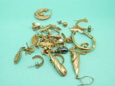 Eight pairs of 9ct gold earrings including pearl and amethyst earrings, studs, hoops etc, 12.3g.