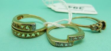 Three 9ct gold rings one set with yellow paste and the other clear paste