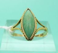 A 9ct gold ring set with a marquise cut jadeite cabochon (Size O)