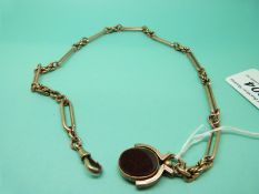 A 9ct gold Albert/watch chain made up of knotted and elongated links with a 9ct gold swivel fob set