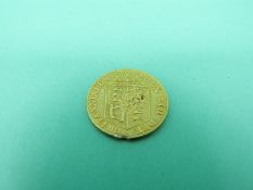 An 1818 gold half spade guinea,