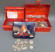 A collection of world and UK coinage in two vintage cash boxes, includes approx 96g of mixed silver,