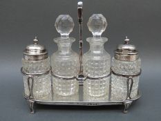 A Georgian hallmarked silver four bottle cruet, marked to base for London 1802,