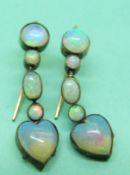 A pair of Victorian drop earrings set with oval and circular opal cabochons with a heart opal