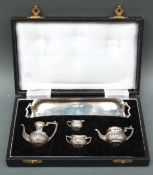 A miniature or doll's hallmarked silver tea service in original case,