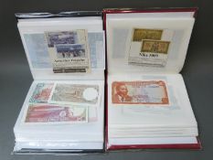Over eighty world bank notes in two albums,