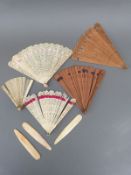 Five 19thC/early 20thC ivory and other fans, some with fine fretwork decoration,
