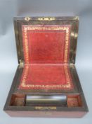 A 19thC walnut writing slope with inset leather interior,
