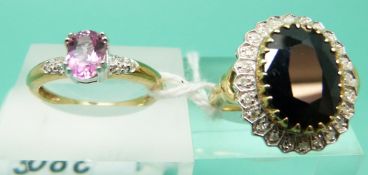 A 9ct gold ring set with a large sapphire surrounded by diamonds and a 9ct gold ring set with a