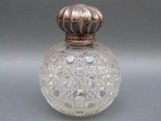 A Victorian hallmarked silver-topped hobnail glass dressing table bottle,