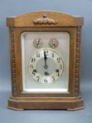 A 20th Century Wurtemberg oak mantel clock with chime silent facility and Arabic silvered dial