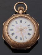 A 14ct gold ladies keyless winding fob watch with enamel scene to the case back depicting a lady
