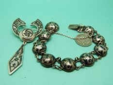A Russian silver niello bracelet and brooch.