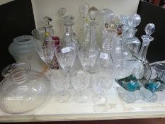 A collection of mainly cut glass 19thC and later decanters and other glass ware