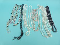 Nine pearl necklaces including freshwater pearls in different colours,