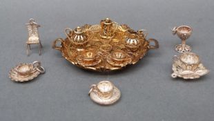 A filigree gilt miniature tea set on tray marked Poland to the bottom, width 7cm,