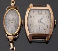 A 9ct gold tonneau shaped gentleman's wristwatch with subsidiary seconds dial,