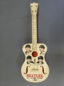 Beatles four string toy guitar by Selcol England,