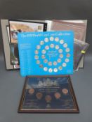 A coin and stamps of the world album together with a framed 