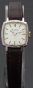 Bulova ladies wristwatch with black hands and baton numerals and bevelled case,