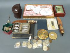 A quantity of items to include a bakelite box, plated spoons, boxed dressing table set,