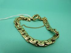 A yellow metal bracelet marked 14K, 15.7g.