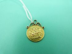 A 1911 gold half sovereign with 9ct gold mount, weight 4.