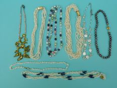 Eight pearl necklaces including two multi strand examples, a multi coloured example,