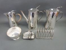A graduated set of three Asprey silver plated lidded jugs, largest 22cm tall,