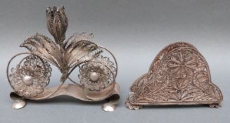 A silver filigree letter rack with Polish marks,