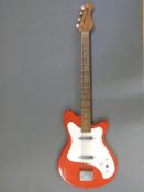 Vox electric bass guitar in red and white finish