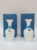 A pair of St Louis glass vases with applied blue decoration in the form of a stylised snake over