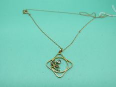 A 9ct gold Edwardian pendant set with an aquamarine and seed pearls on a 9ct gold chain, weight 2.