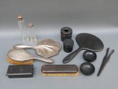 An unusual hallmarked silver-mounted hand mirror, a hallmarked silver-mounted brush,