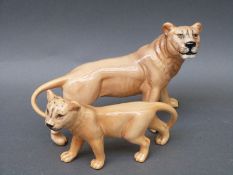 A Beswick lioness and cub