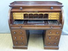 A 19thC mahogany cylinder bureau,