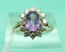 A 9ct gold ring set with paste.