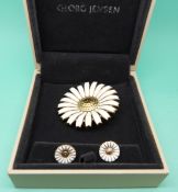 A Georg Jensen daisy brooch and matching earrings, in original box.