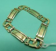 A gold bracelet marked 585 B + G, 28.9g.