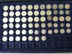 A metal collectors case containing a quantity (approx 30) £1 coins together with modern crowns