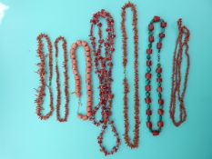 Seven coral necklaces including a pink coral necklace made up of barrel shaped beads etc