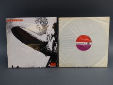 Led Zeppelin self titled debut from 1969 on red/plum Atlantic, 2nd issue with Warner Bros credit.