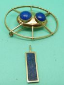 A 9ct gold brooch set with two lapis lazuli cabochons and a lapis lazuli pendant