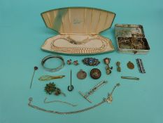 A collection of jewellery to include a mizpah silver pendant, white metal bangle,