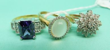 Two 9ct gold rings set with diamonds and cubic zirconia and a yellow metal ring marked 10kt