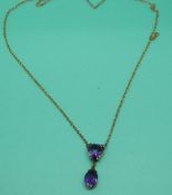 A 9ct gold Edwardian/Victorian necklace set with a heart amethyst with a drop oval amethyst in