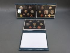Three deluxe cased Royal Mint proof coin sets 1992, 1993,