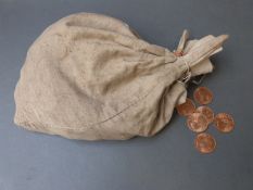 A bag of 1967 pennies in canvas bag with lead seal,